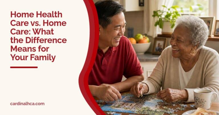 A caregiver and an older woman laugh together over a jigsaw puzzle at a sunny kitchen table.